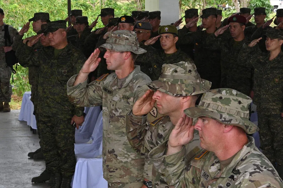 Philippine and US army soldiers during the US-Philippines Arm-to-Army exercise at Fort Magsaysay, north of Manila on March 13.