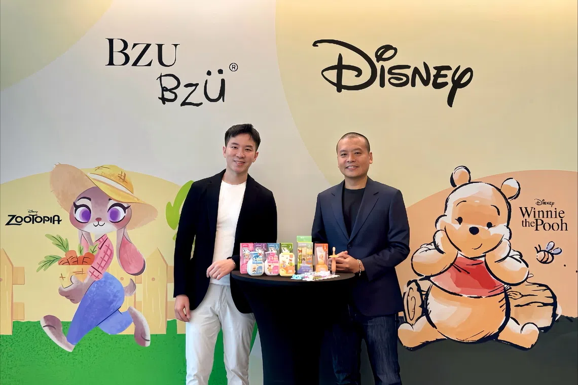 Mr Raphael Jiang (left), Chief Executive Officer and Co-founder of BZU BZU, and Mr Tan Wee, Director, Disney Consumer Products, South Asia Pacific, with BZU BZU’s new children’s oral care range featuring Disney’s Zootopia and Winnie the Pooh. 
