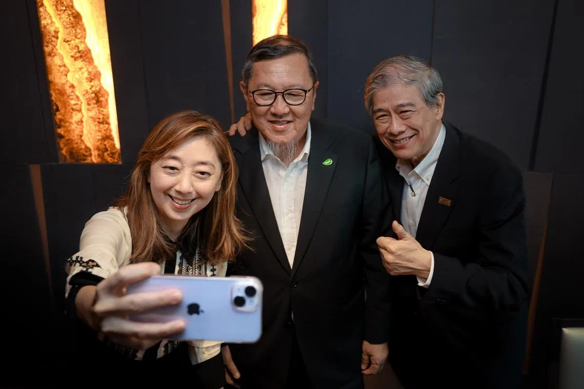 Malaysians Andrew Lim (right) and Gary Yap say economies of scale will improve pricing in Singapore and customers can see a greater variety of merchandise.