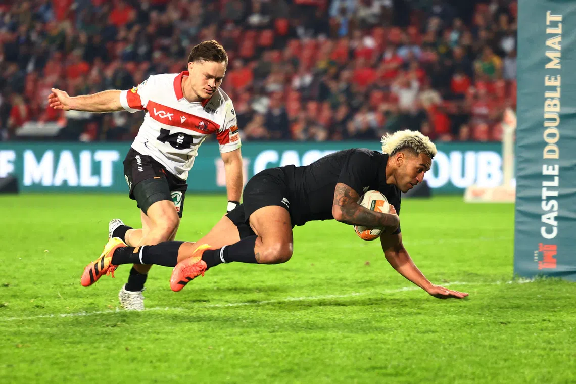 New Zealand’s Rieko Ioane scoring their fifth try against the Lions at Ellis Park Stadium in Johannesburg on Aug 25. The All Blacks won 41-35.
