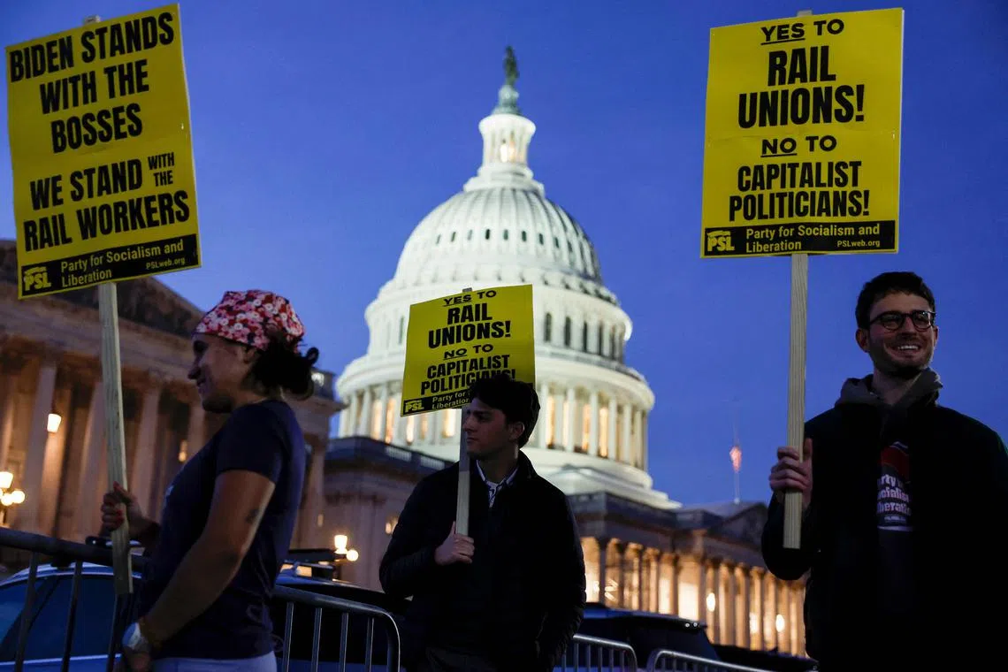 WASHINGTON, DC - NOVEMBER 29: Activists in support of unionized rail workers protest outside the U.S. Capitol Building on November 29, 2022 in Washington, DC. President Joe Biden has called on Congress to pass legislation averting a railroad shutdown ahead of the December 9 coordinated strike date.   Anna Moneymaker/Getty Images/AFP (Photo by Anna Moneymaker / GETTY IMAGES NORTH AMERICA / Getty Images via AFP)