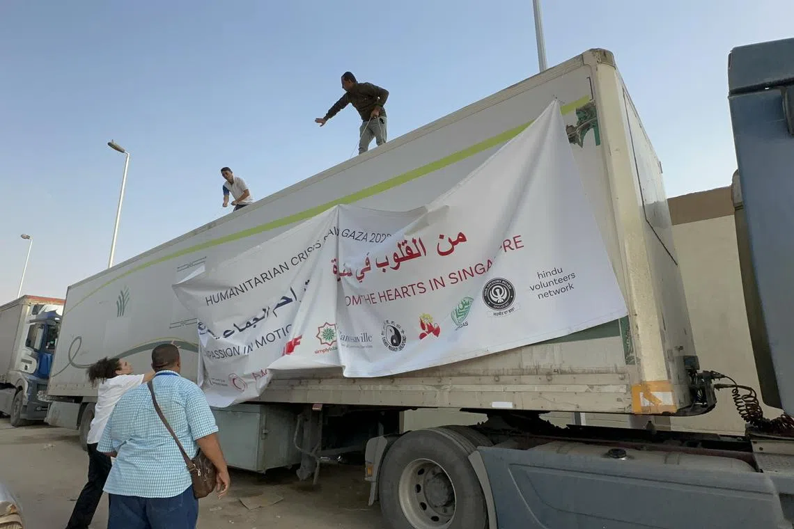 A truck carrying some 9.5 tonnes of aid from Singapore for civilians in Gaza is being prepped in Cairo.
