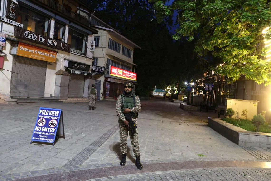 Indian paramilitary soldiers stand guard in the wake of a deadly attack on tourists in Indian-administered Kashmir, in Srinagar.