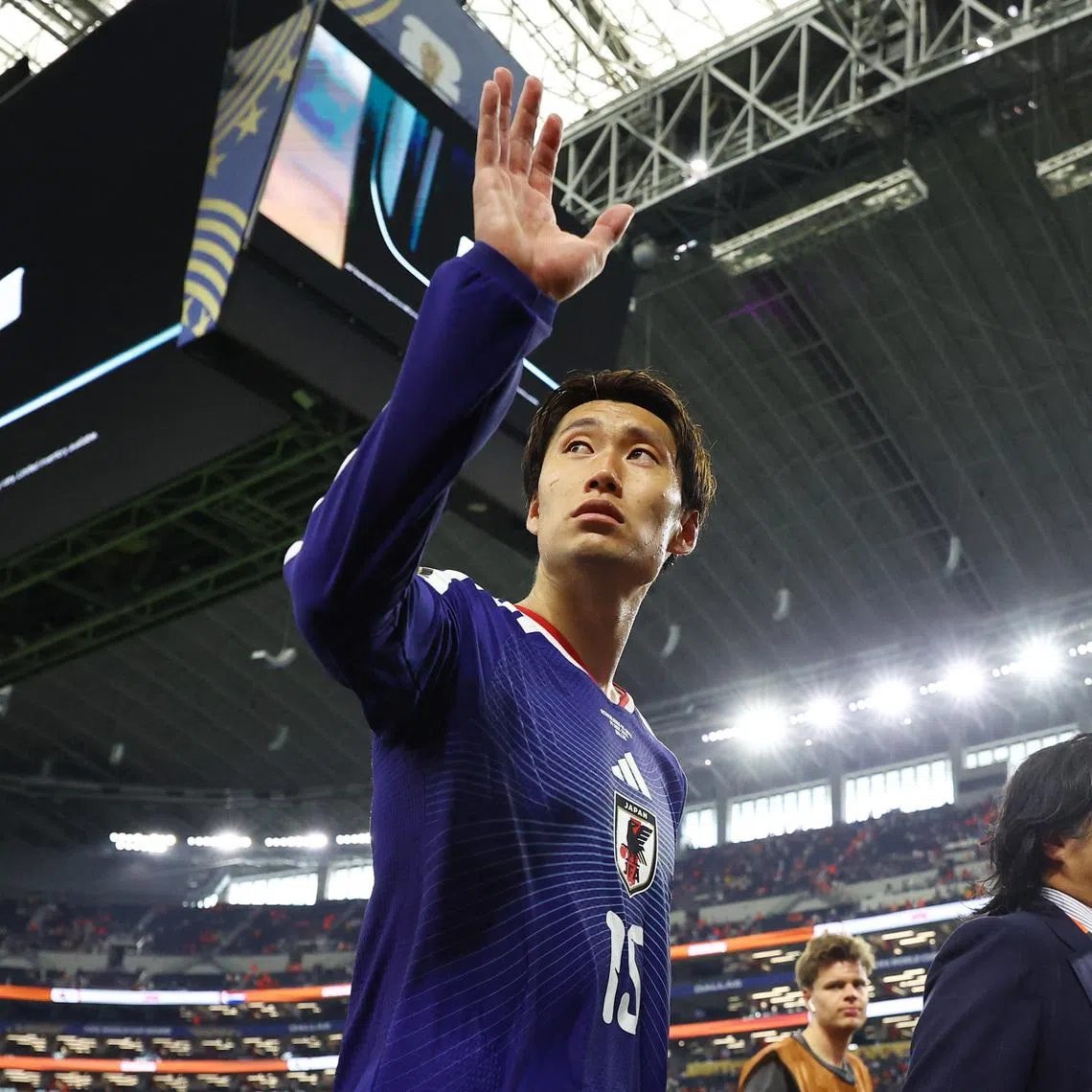 Soccer Football - FIFA World Cup 2026 - Group F - Netherlands v Japan - Dallas Stadium, Arlington, Texas, U.S. - June 14, 2026 Japan's Daichi Kamada salutes their fans as he leaves the pitch after the match REUTERS/Hannah Mckay