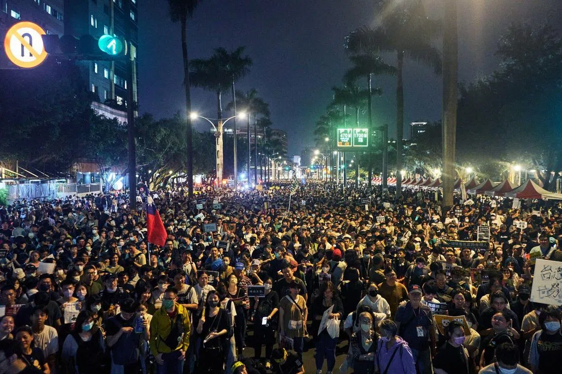 Demonstrators during a protest outside the Legislative Yuan in Taipei, on May 24.