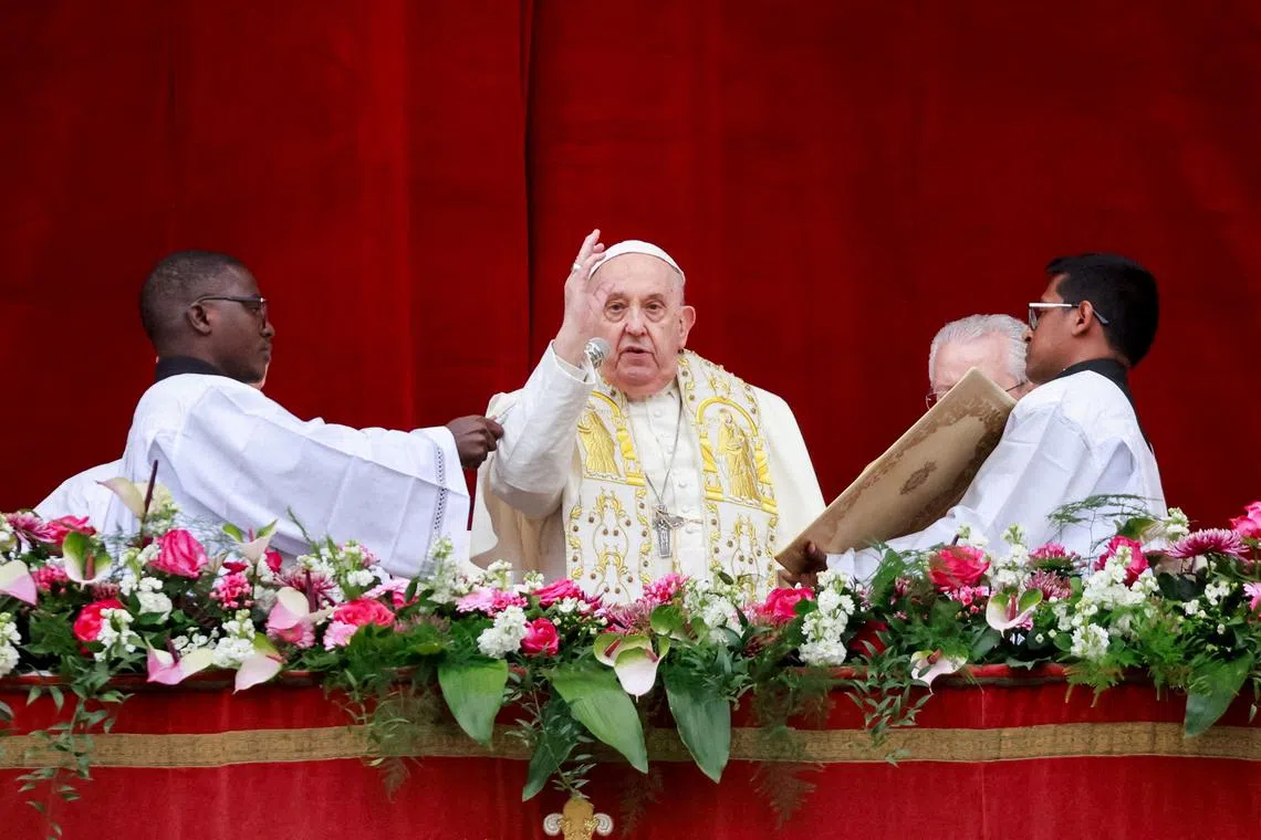 FILE PHOTO: Pope Francis delivers his \"Urbi et Orbi\" (To the city and the world) message at St. Peter's Square, on Easter Sunday, at the Vatican March 31, 2024. REUTERS/Yara Nardi/File Photo