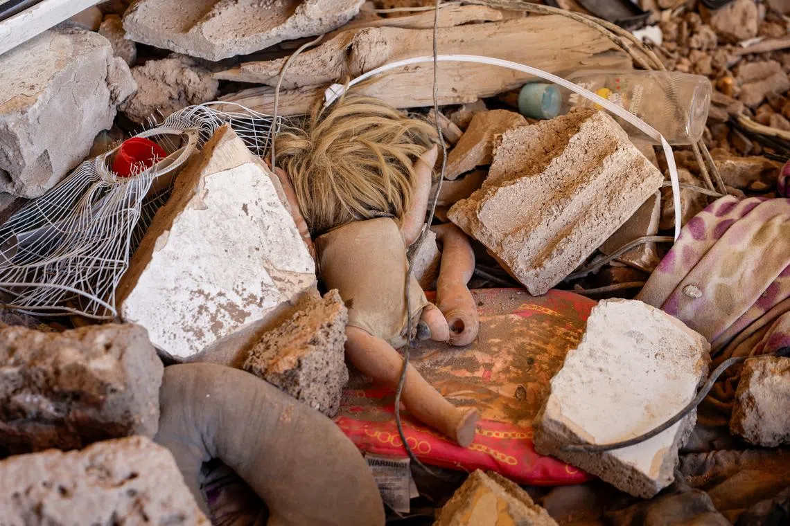 Children's toys as seen among rubble at Ahmed Al-Khatib's apartment, whose wife and daughter were injured at the strike site, in Beirut. 