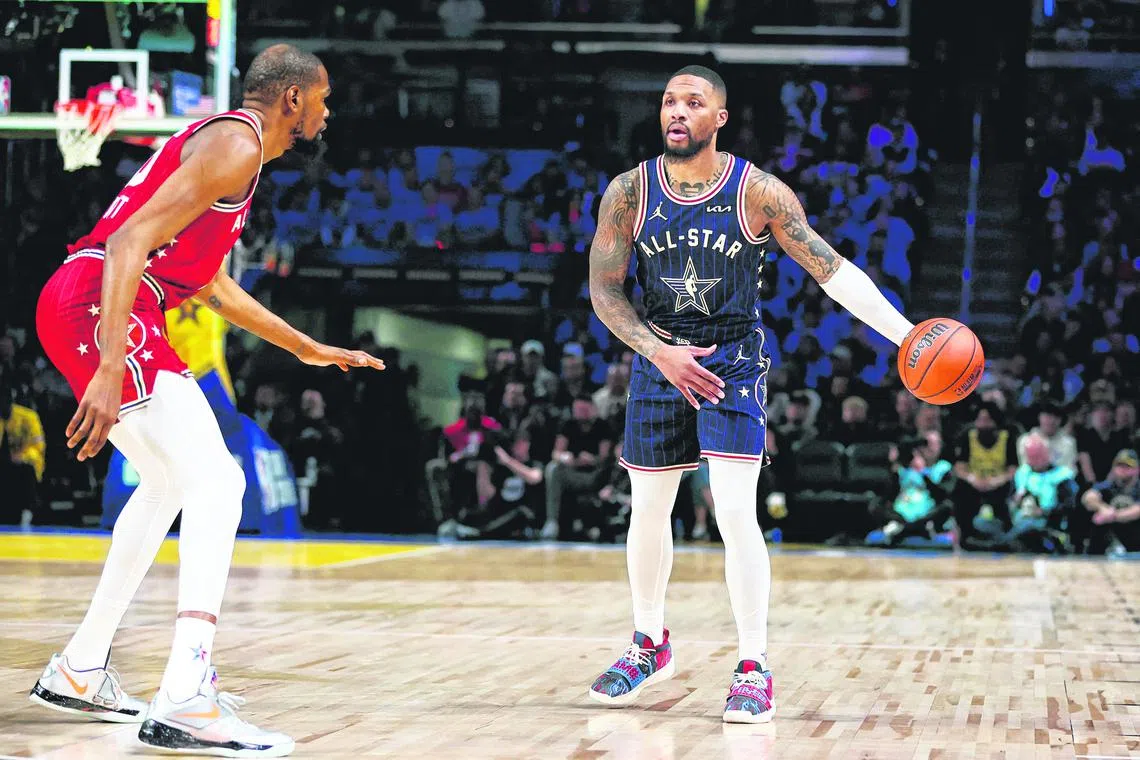Damian Lillard of the Milwaukee Bucks and Eastern Conference All-Stars dribbling the ball against Kevin Durant of the Phoenix Suns and Western Conference All-Stars in the first quarter during the 2024 NBA All-Star Game at Gainbridge Fieldhouse on Feb 18.