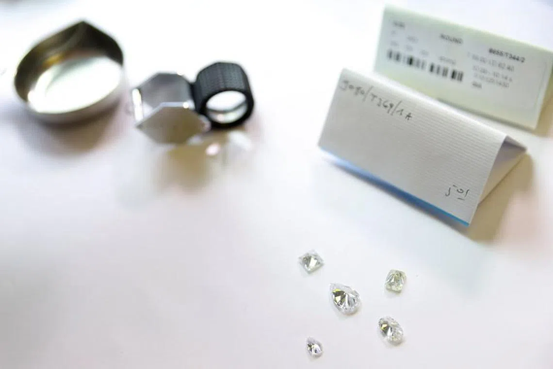 FILE PHOTO: Cut diamonds are seen at T. Diamonds on the diamond exchange in Antwerp, as the G7 weighs a ban on Russian diamond imports to reduce revenues for Moscow's war in Ukraine, Antwerp, Belgium, October 30, 2023. REUTERS/Johanna Geron/File Photo