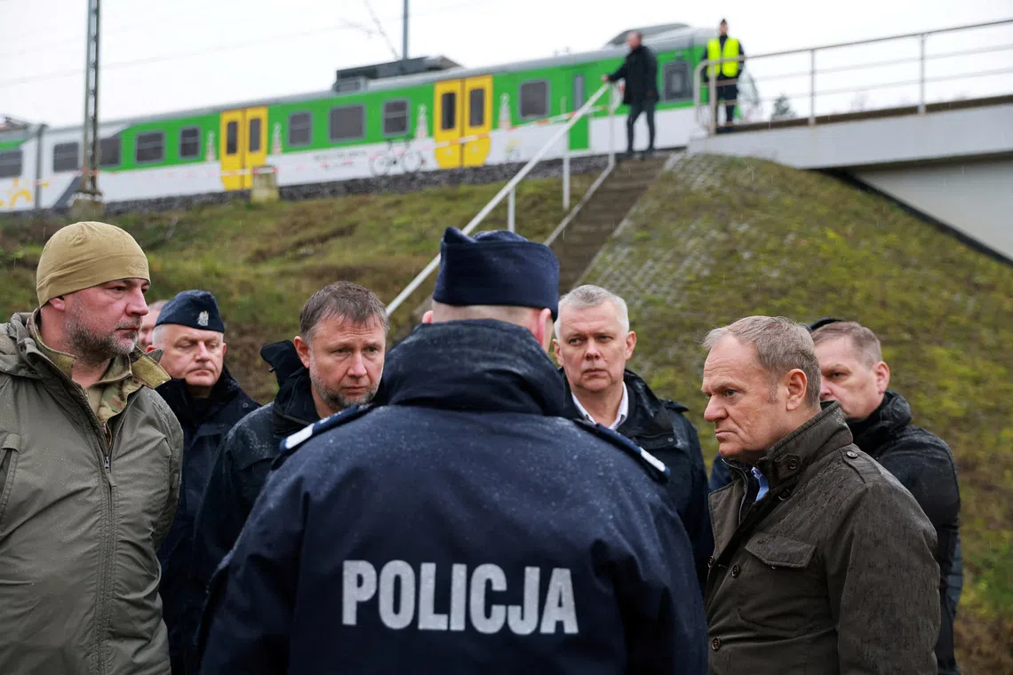 FILE PHOTO: Polish Prime Minister Donald Tusk visits the site of a blast on railway of the Warsaw-Lublin line in Mika, Poland, November 17, 2025. KPRM/Handout via REUTERS /File Photo