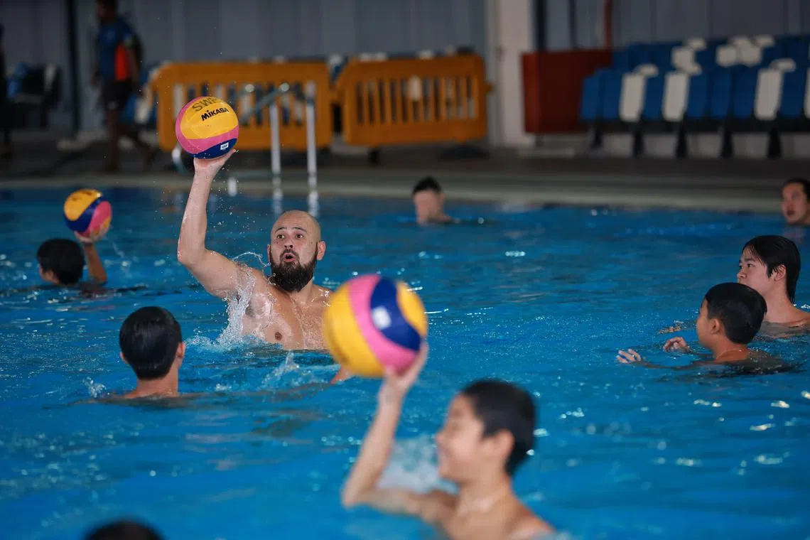 Japanese national goalkeeper Katsuyuki Tanamura conducting a workshop to local water polo players at Our Tampines Hub. He was in Singapore for about a month giving clinics and helping with the national team's training sessions.