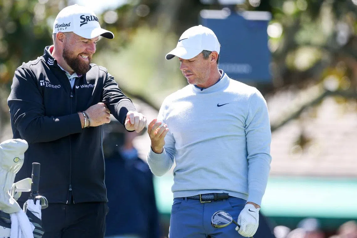 Shane Lowry of Ireland and Rory McIlroy of Northern Ireland share a moment at the Arnold Palmer Invitational.