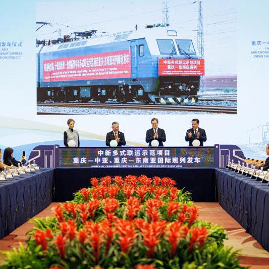 Deputy Prime Minister Gan Kim Yong and Chinese Vice-Premier Ding Xuexiang (next to him), with Minister for Digital Development and Information Josephine Teo and Chongqing Party Secretary Yuan Jiajun, witnessing the virtual launch of two trains from Yuzui Terminal South Yard to Central Asia and South-east Asia, reflecting how the multimodal trade corridor has enhanced Chongqing’s connectivity.
