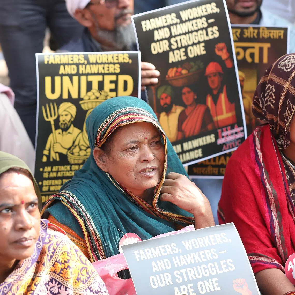 epa12549719 Members of different trade unions and workers hold placards and shout slogans during a protest in New Delhi, India, 26 November 2026. A coalition of ten major Indian trade unions staged nationwide protests condemning the government’s implementation of new labor codes as a 'deceptive fraud' against workers.  EPA/HARISH TYAGI