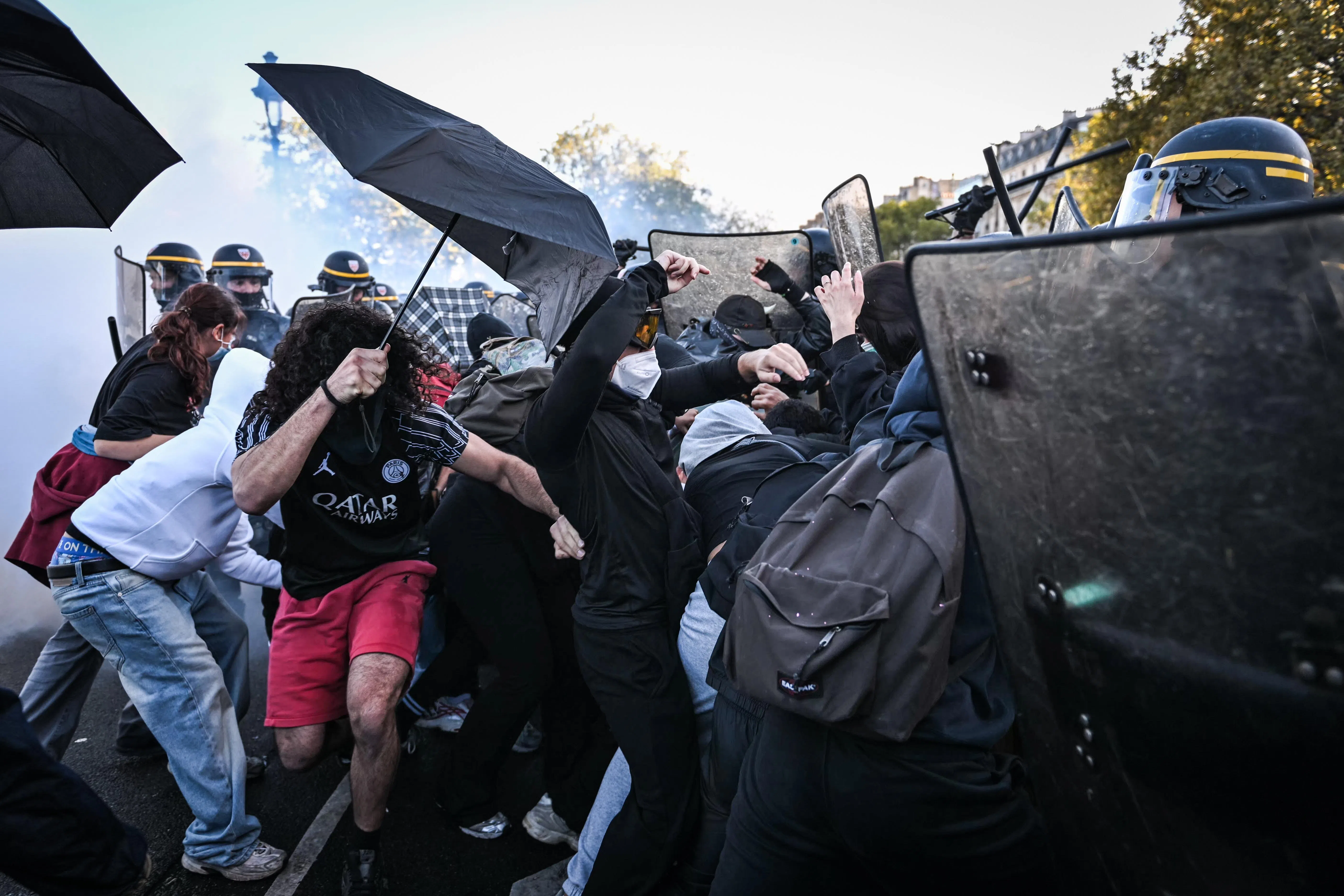 Riot police clashing with protesters in Paris’ Bastille square on Oct 8.