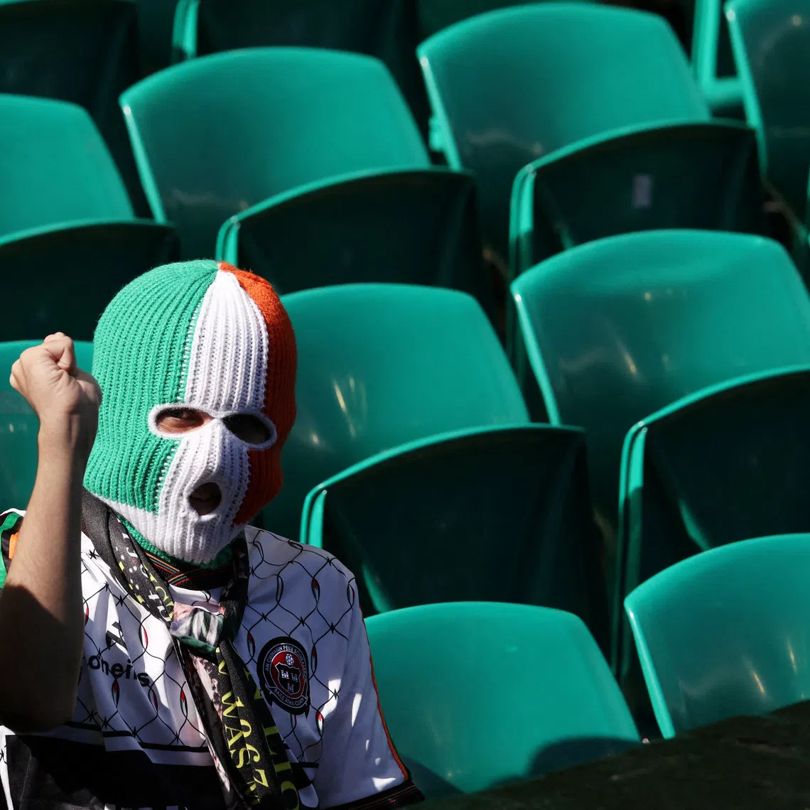 Soccer Football - Scottish Premiership - Celtic v Rangers - Celtic Park, Glasgow, Scotland, Britain - May 10, 2026 A fan wears a balaclava inside the stadium before the match REUTERS/Russell Cheyne
