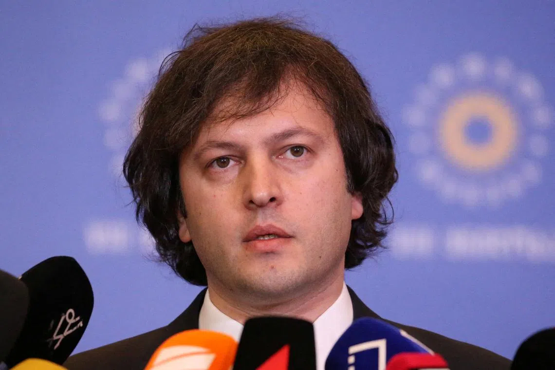 FILE PHOTO: Irakli Kobakhidze, nominated by the ruling Georgian Dream party for the post of prime minister, talks to journalists after the party's congress in Tbilisi, Georgia February 1, 2024. REUTERS/Irakli Gedenidze/File Photo