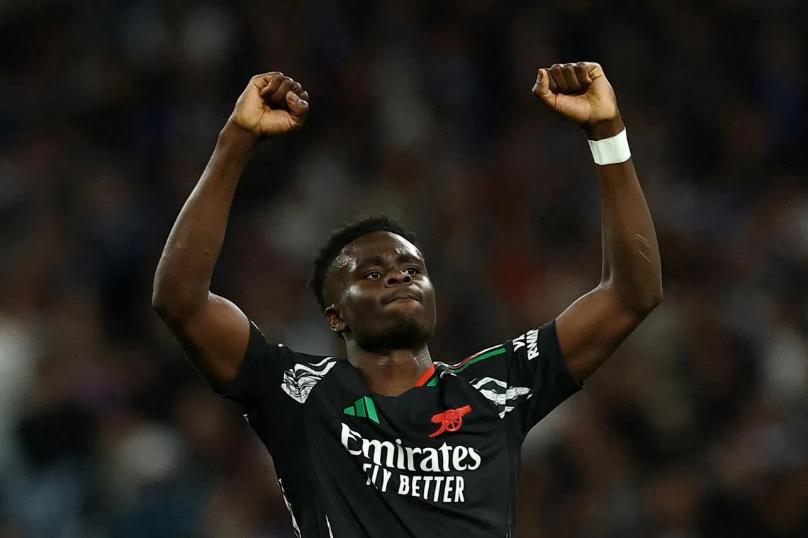 Soccer Football - Champions League - Quarter Final - Second Leg - Real Madrid v Arsenal - Santiago Bernabeu, Madrid, Spain - April 16, 2025 Arsenal's Bukayo Saka celebrates scoring their first goal Action Images via Reuters/Lee Smith