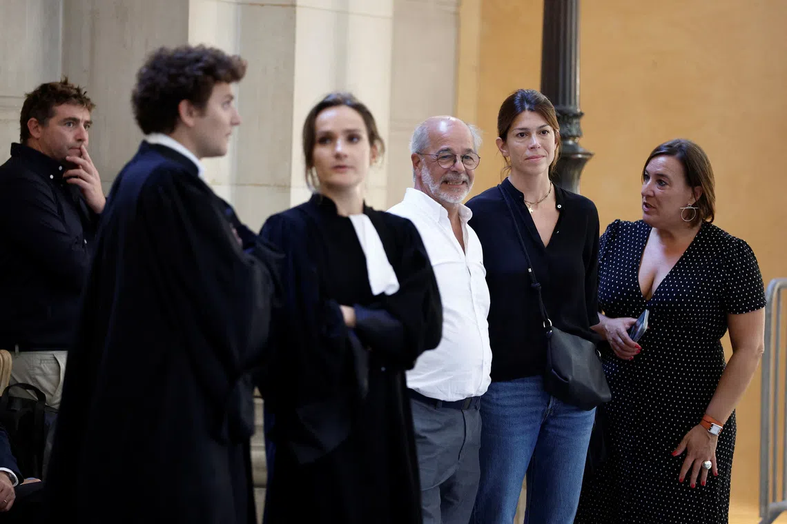 Maria Aramburu, widow of former Argentine rugby international Federico Martin Aramburu, former rugby player Shaun Hegarty and lawyers arrive for the trial of far-right activists Loik Le Priol and Romain Bouvier, who are charged with murder and attempted murder over the 2022 shooting death of Federico Martin Aramburu, at the criminal court in Paris, France, September 7, 2026. REUTERS/Benoit Tessier