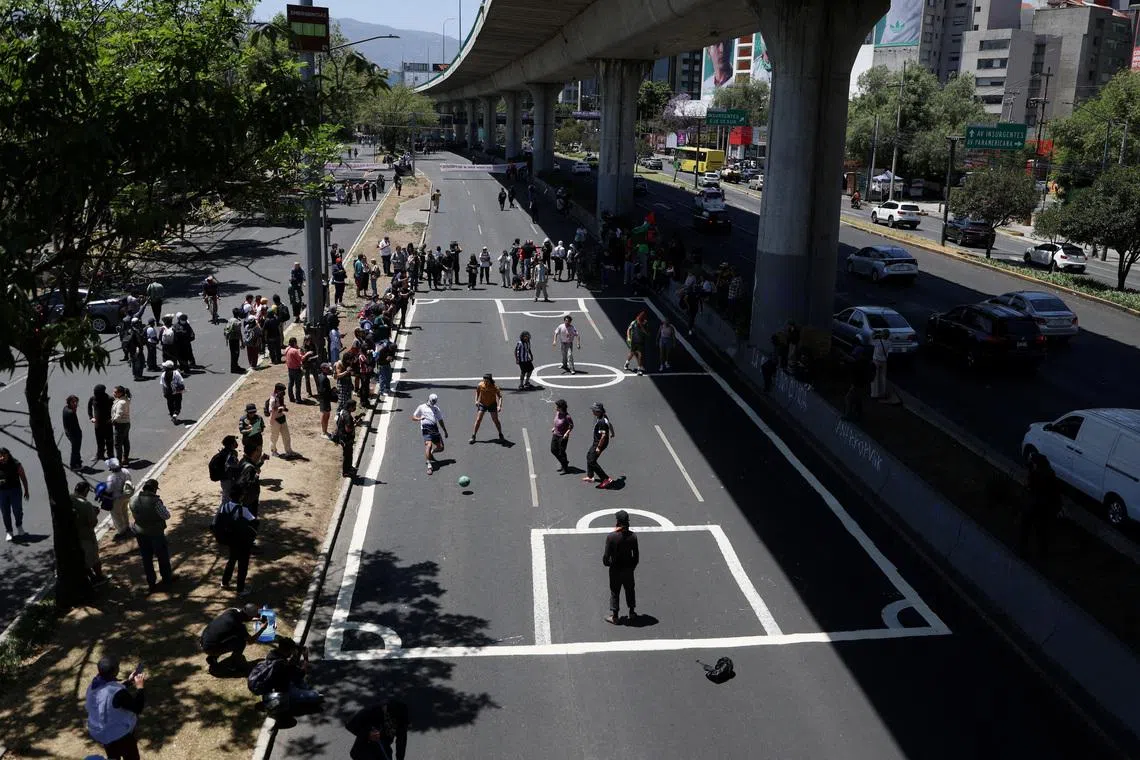 Mexican protesters turn highway into football pitch to slam World Cup 'dispossession'