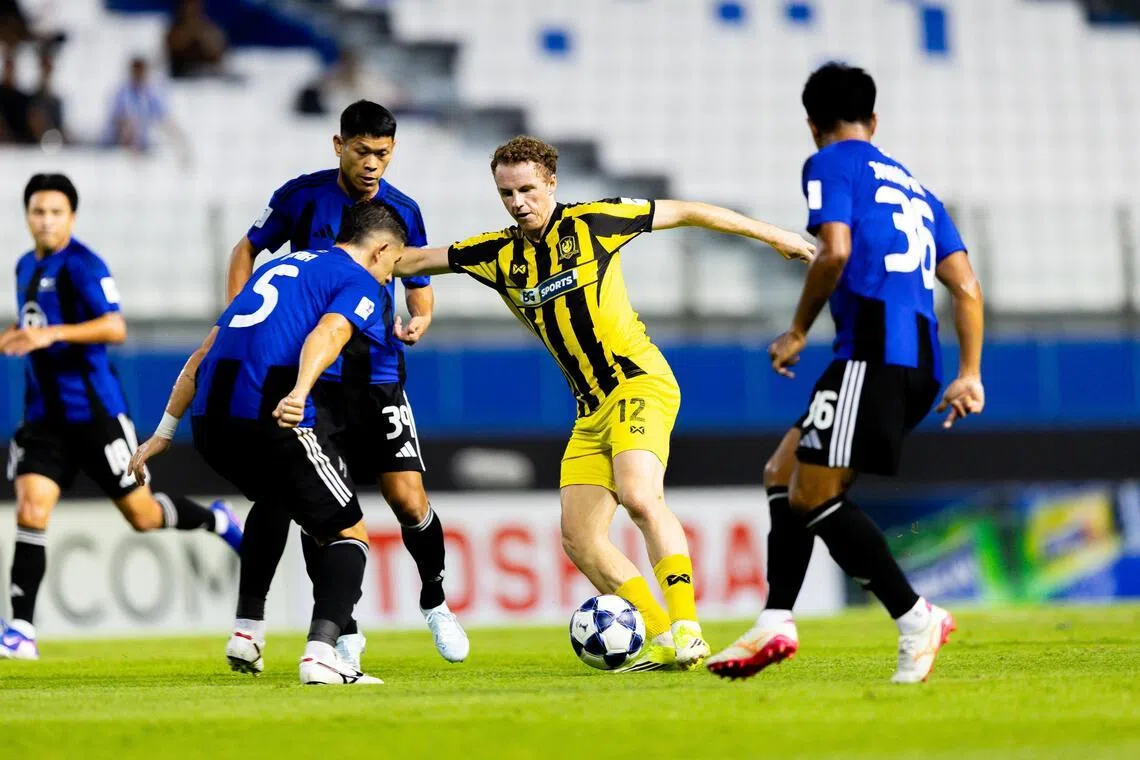 BG Tampines Rovers attacker Trent Buhagiar, surrounded by (from right) Bangkok United's Jakkapan Praisuwan Pokklaw Anan and Philipe Maia, grabs a goal for the Stags in their 2-1 loss in their AFC Champions League quarter-final first-leg match.