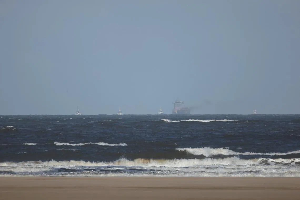 A view shows the damaged cargo ship Solong, after it collided with a hull of Stena Immaculate oil tanker ship, as seen from Saltfleet, Britain, March 11, 2025. REUTERS/Phil Noble