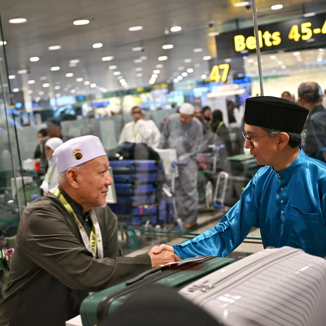 Acting Minister-in-charge of Muslim Affairs, Assoc Prof Dr Faishal Ibrahim, welcoming back the final group of Singapore Haj pilgrims at Changi Airport Terminal 3, on Wednesday afternoon, Jun 25, 2025.