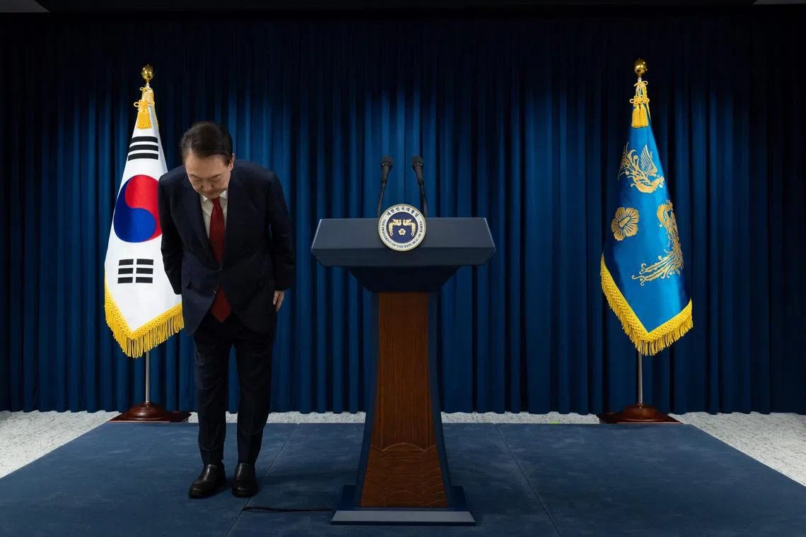 South Korea's President Yoon Suk Yeol bowing after the end of his address at the Presidential Office in Seoul, on Dec 7.