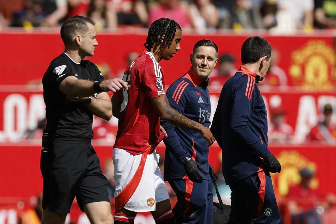 Soccer Football - Premier League - Manchester United v West Ham United - Old Trafford, Manchester, Britain - May 11, 2025 Manchester United's Leny Yoro is substituted after sustaining an injury Action Images via Reuters/Jason Cairnduff
