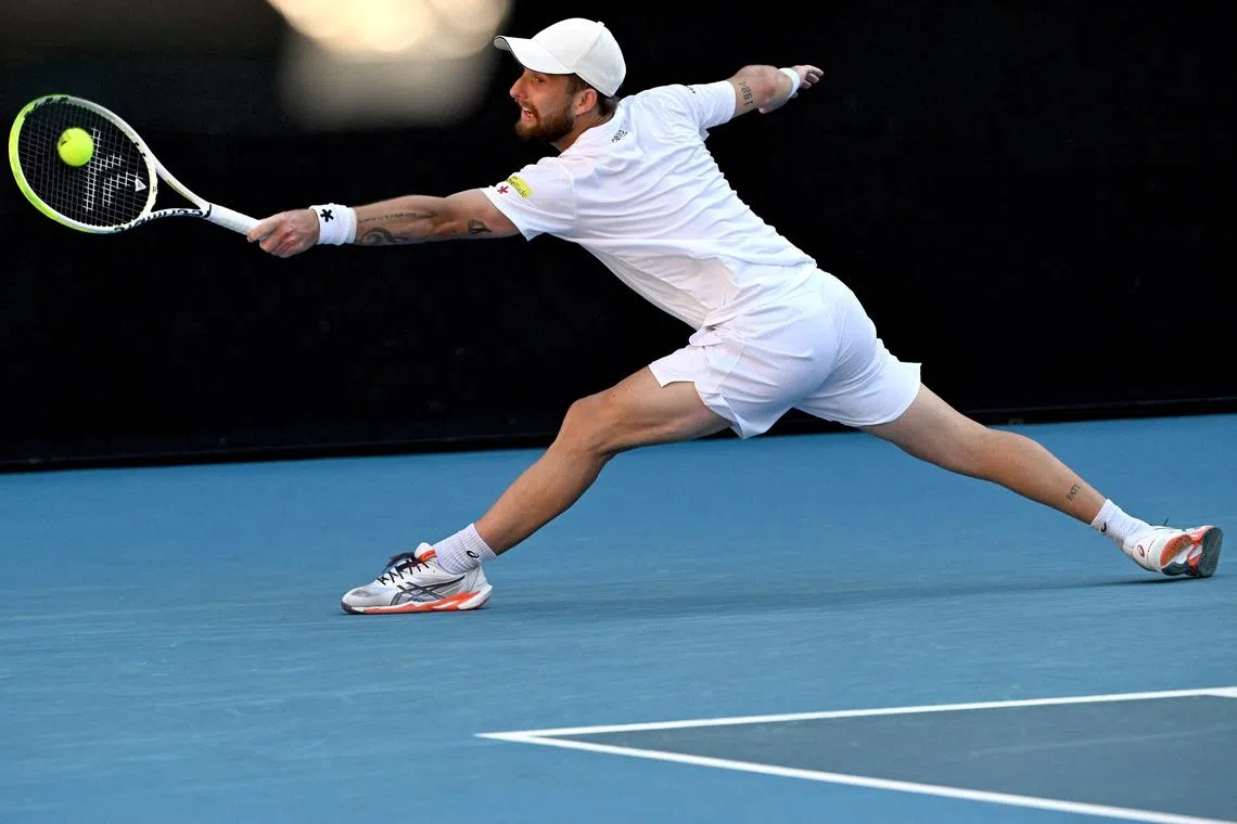 France's Corentin Moutet hitting a return against the United States' Learner Tien during their men's singles match on day seven of the Australian Open tennis tournament in Melbourne on Jan 18.
