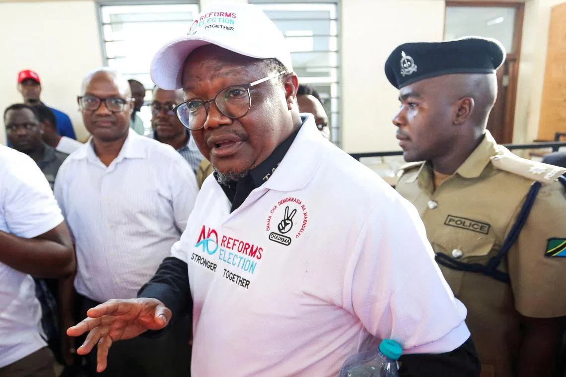 FILE PHOTO: Tanzanian opposition leader and former presidential candidate of CHADEMA party Tundu Lissu is escorted as he walks at the Kisutu Resident Magistrate Court in Dar es Salaam, Tanzania April 10, 2025. REUTERS/Emmanuel Herman/File Photo