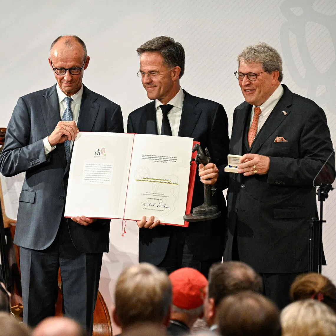 German Chancellor Friedrich Merz (left) was speaking at an event on Oct 1 where the 2026 Westphalian Peace Prize was awarded to the NATO alliance.