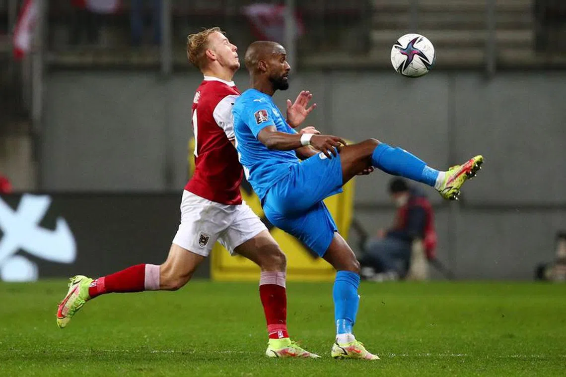 Soccer Football - World Cup - UEFA Qualifiers - Group F - Austria v Israel - Worthersee Stadion, Klagenfurt, Austria - November 12, 2021 Austria's Marco Grull in action with Israel's Eli Dasa REUTERS/Lisi Niesner/file photo