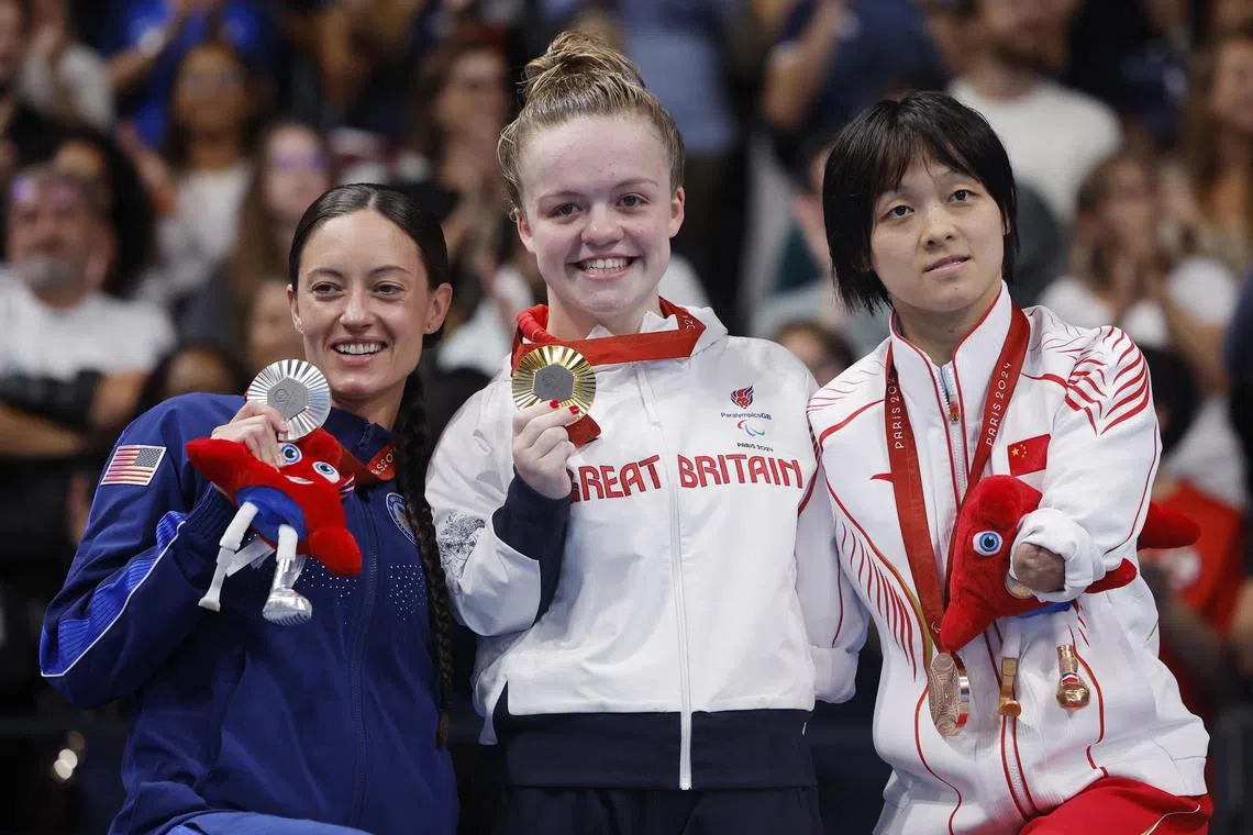 British gold medallist Maisie Summers-Newton, with silver medallist Ellie Marks of the US and bronze medallist Liu Daomin, of China.