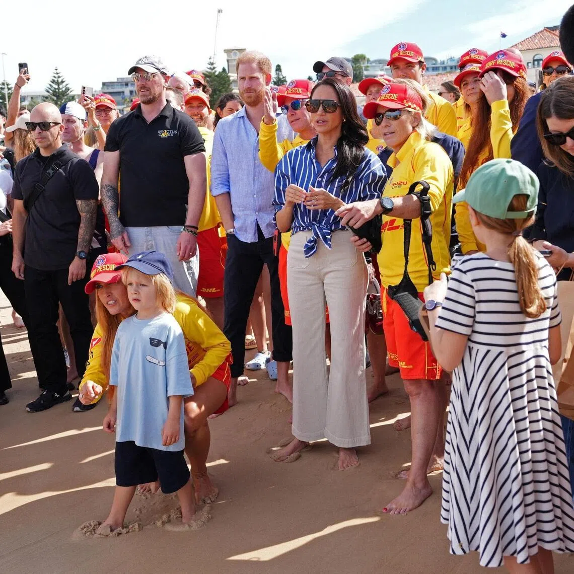 Britain's Prince Harry and Meghan, the Duke and Duchess of Sussex, also met volunteer first responders from Bondi Surf Bathers' Life Saving Club, during a visit to Bondi Beach.