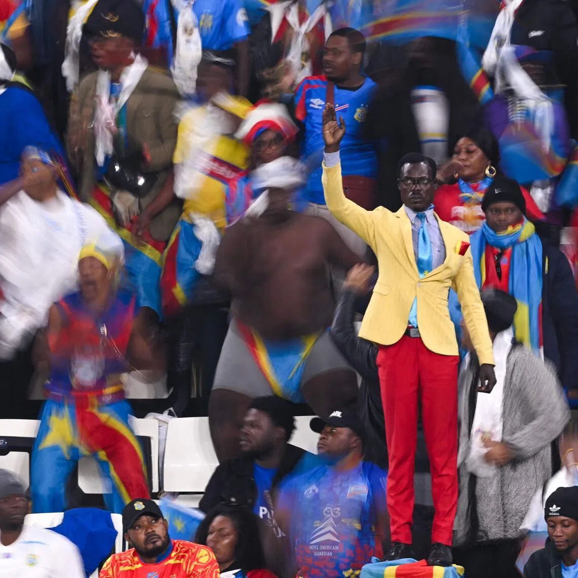 Democratic Republic of Congo's supporter Michel Kuka Mboladinga pays tribute to his country's late prime minister Patrice Lumumba, by remaining motionless during the Africa Cup of Nations Group D football match against Botswana at El Madina Stadium in Rabat on Dec 30, 2025.
