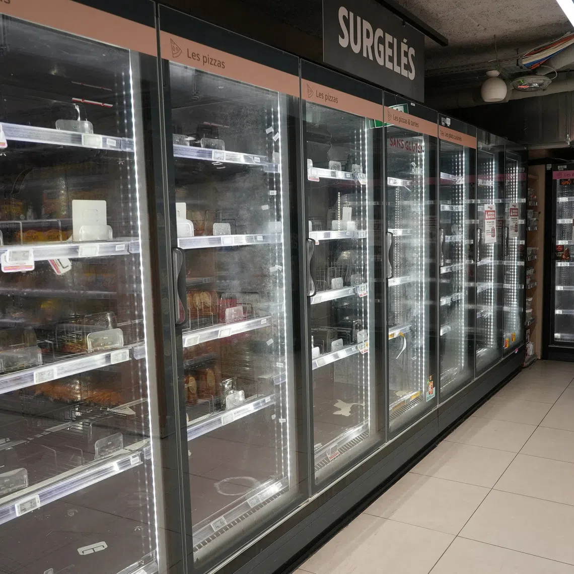 View of empty refrigerators at the frozen food aisle inside an Intermarche supermarket in Paris, the day after a cyberattack targeted refrigeration systems at French supermarket chains, on Oct 13.