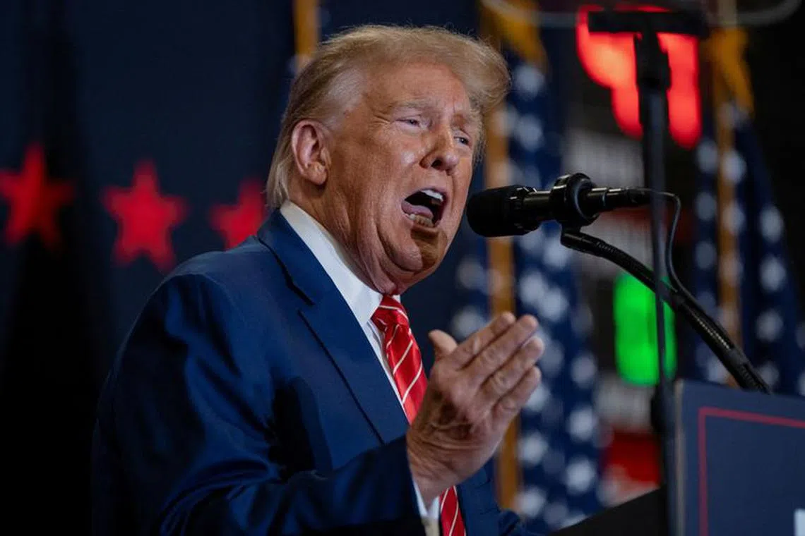 FILE PHOTO: Former U.S. President and Republican presidential candidate Donald Trump speaks during a campaign event, in Clinton, Iowa, U.S., January 6, 2024. REUTERS/Cheney Orr/File Photo