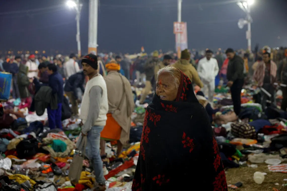 A devotee stands after a deadly stampede before the second \"Shahi Snan\" (grand bath), at the \"Kumbh Mela\" or the Pitcher Festival, in Prayagraj, previously known as Allahabad, India, January 29, 2025.  REUTERS/Sharafat Ali