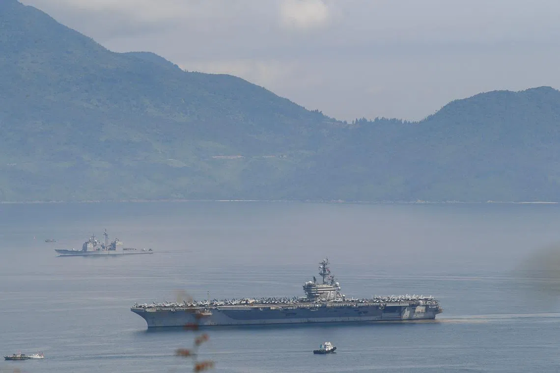 The USS Ronald Reagan, a US Navy Nimitz-class nuclear-powered aircraft carrier, pulls into port in Danang.