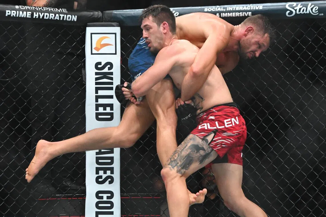Brendan Allen (in red shorts) gaining the upper hand over Reinier de Ridder during UFC Fight Night at Rogers Arena on Oct 18 night.
