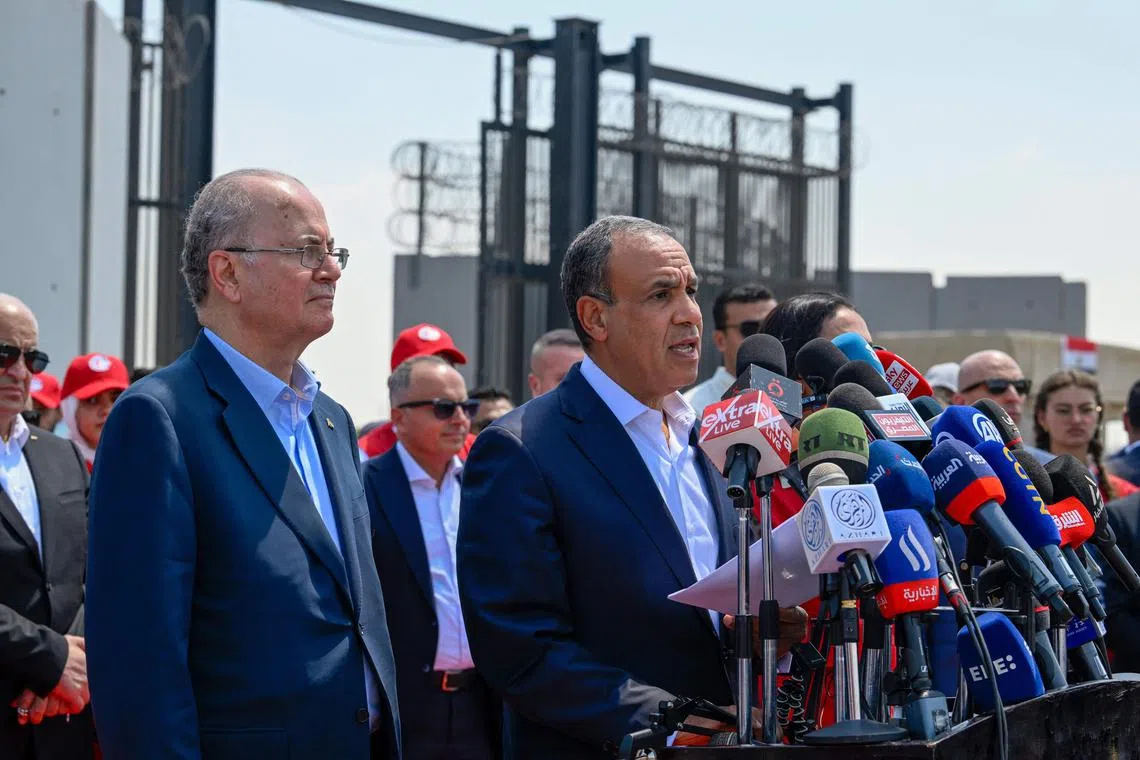 Palestinian prime minister Mohammad Mustafa (left) listens as Egypt's Foreign Minister Badr Abdelatty (centre) speaks at a press conference on the Egyptian side of the Rafah border crossing in Rafah on Aug 18, 2025.