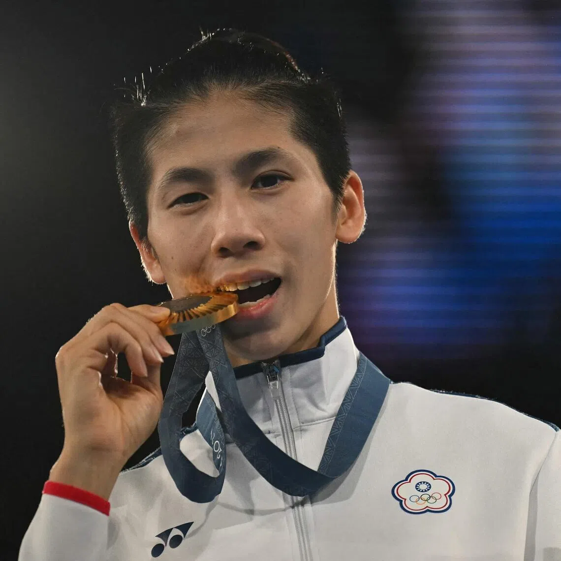 Chinese Taipei’s Lin Yu-ting celebrates on the podium during the medal ceremony at the Paris 2024 Olympic Games.