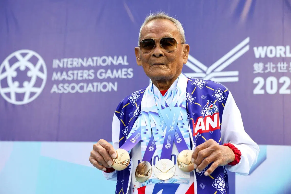 Thailand's Sawang Janpram, the oldest competitor at the 2025 World Masters Games at 105 years old, wins gold medal in the men’s shot put for the 100+age group, in Taipei on May 22, 2025. Sawang is unrivalled at the World Masters Games underway in Taiwan where he ranks as the oldest competitor and the only person in his age group. (Photo by I-Hwa Cheng / AFP) / TO GO  WITH:  Taiwan-Thailand-athletics-elderly, by Allison Jackson and Joy Chiang