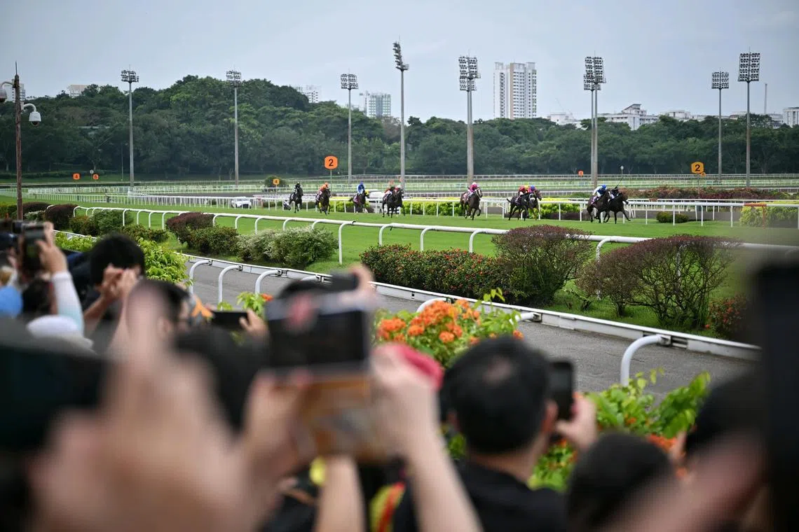 Punters watching the Singapore Derby race on July 21, 2024. The race meeting which started in 1880, was held for the last time before the closure of the Singapore Turf Club after Oct 5.