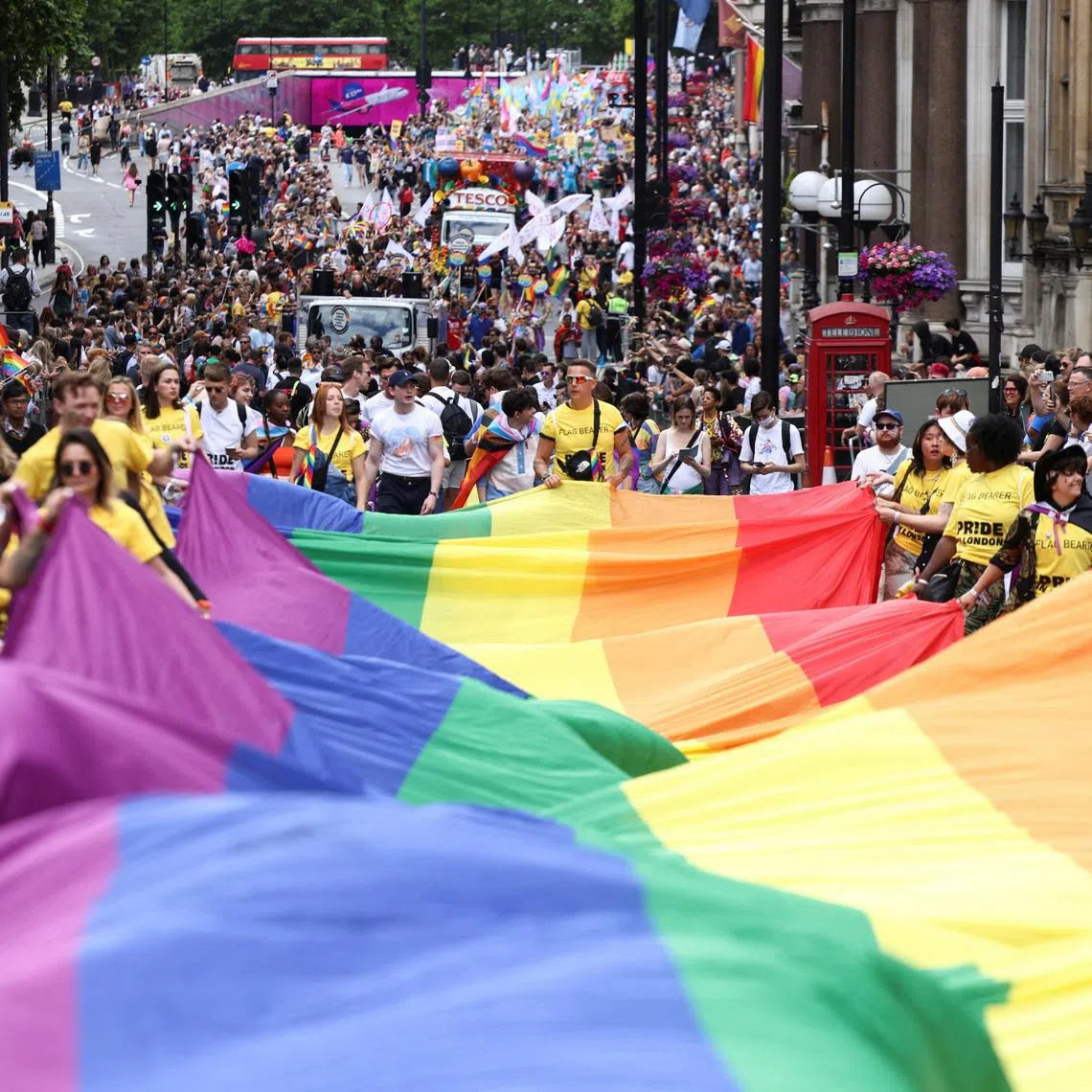 People carry a large rainbow flag, as they take part in the 2022 Pride Parade in London, Britain July 2, 2022. REUTERS/Henry Nicholls