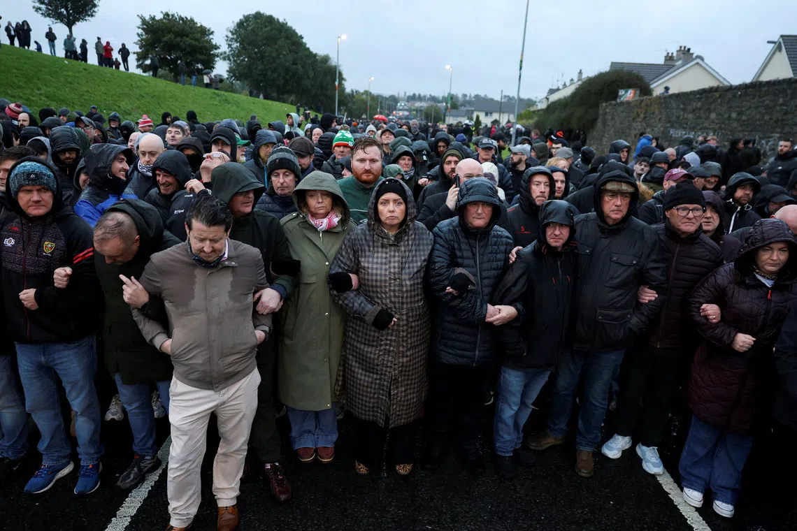 People block the Garvaghy road, a Catholic enclave in the largely Protestant town of Portadown, on the day members of the Protestant Orange Order are expected to march through the area as they take part in the annual Drumcree parade, Northern Ireland, September 27, 2026. REUTERS/Cathal McNaughton