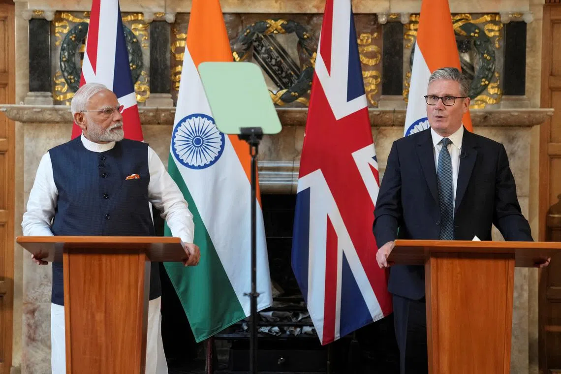 Britain's Prime Minister Keir Starmer and Prime Minister Narendra Modi of India speak during a press conference after signing a free trade agreement at Chequers near Aylesbury, England, Thursday, July 24, 2025. Kin Cheung/Pool via REUTERS