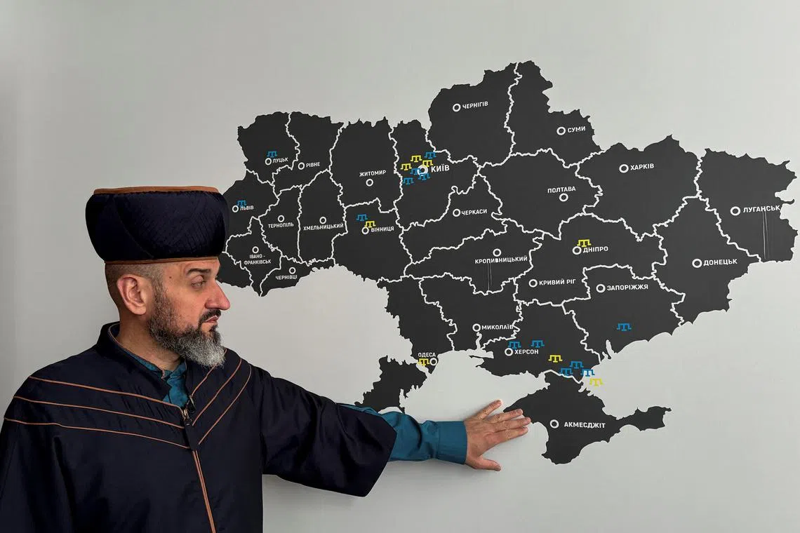 FILE PHOTO: Ayder Rustemov, 45-year-old mufti, shows Crimea peninsula on a map of Ukraine during an interview with Reuters in a mosque, amid Russia's attack on Ukraine, in Kyiv, Ukraine April 30, 2025. REUTERS/Yurii Kovalenko/File Photo