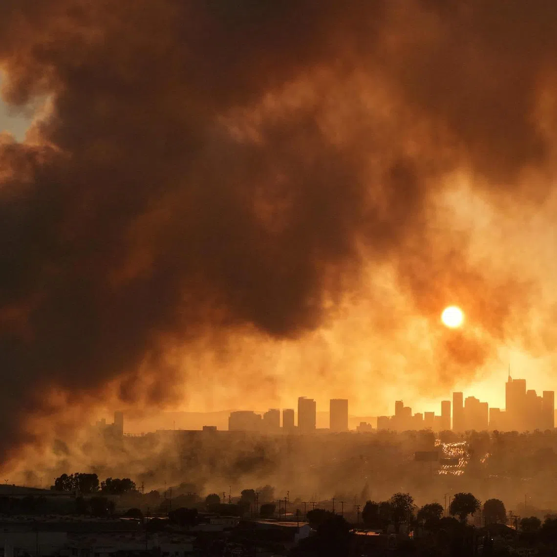 A massive warehouse fire at a cold storage facility continues to burn and spread smoke around Los Angeles on June 20.